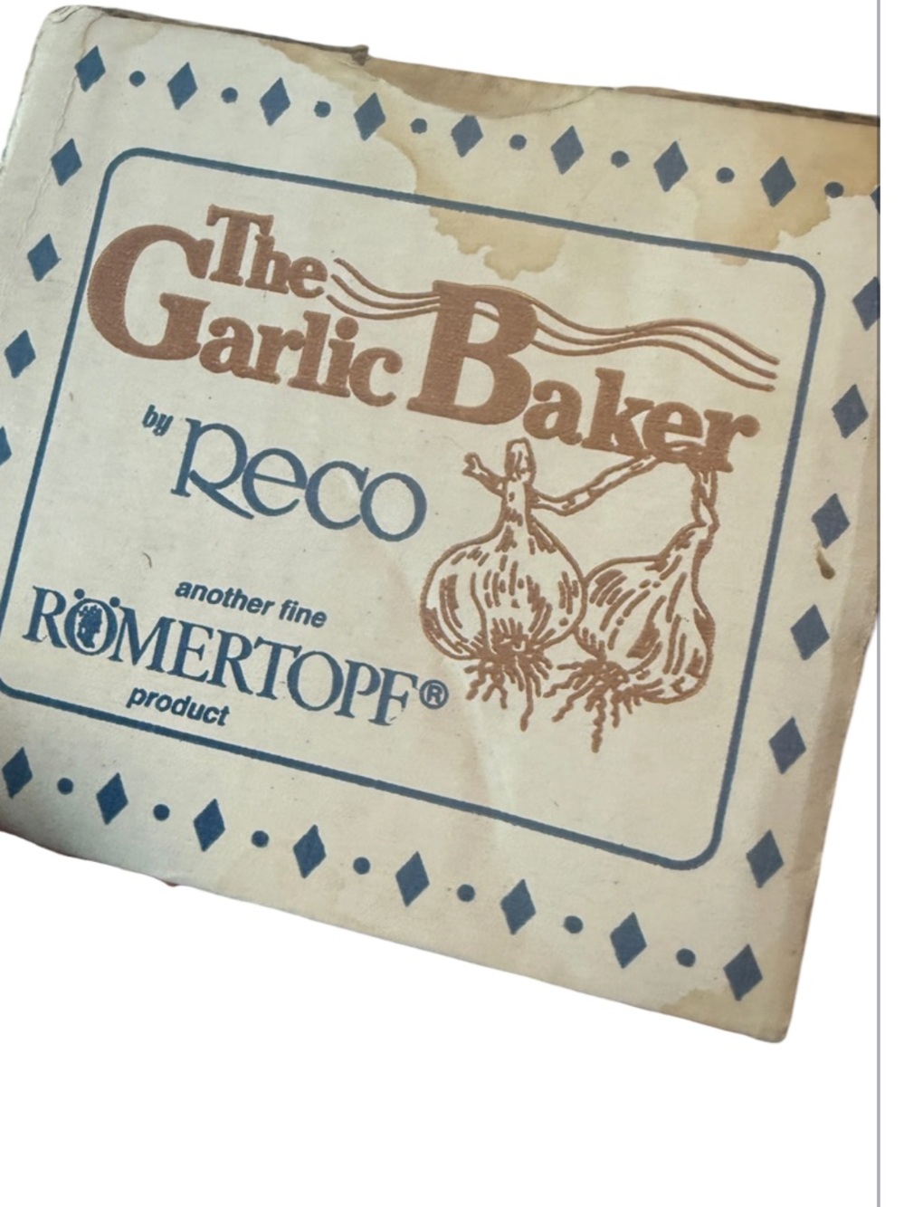 vintage item is a terra cotta garlic roaster produced by Recó under